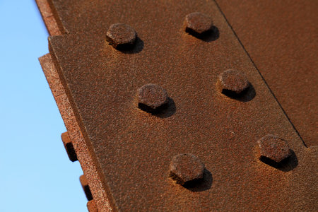 oxidized rusty steel plate and rivet