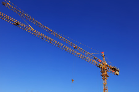Tower crane arm in the blue sky backgroundのeditorial素材