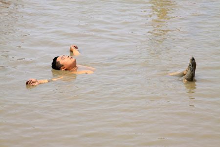 Luannan - July 31: Visitors rest floating in the water, on July 31, 2015, luannan county, hebei province, Chinaのeditorial素材