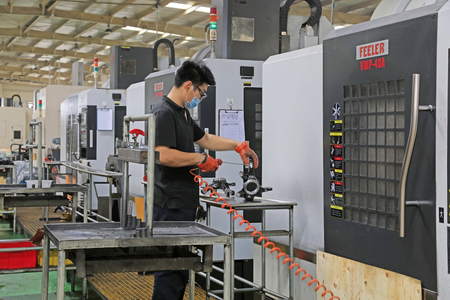 Tangshan City - October 20, 2016: workers busy on the production line in a factory, Tangshan City, Hebei, China

のeditorial素材