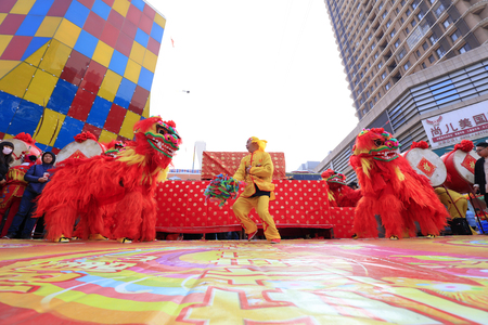 Tangshan City - March 10, 2018: lion dance performance in parks, Tangshan City, Hebei, Chinaのeditorial素材