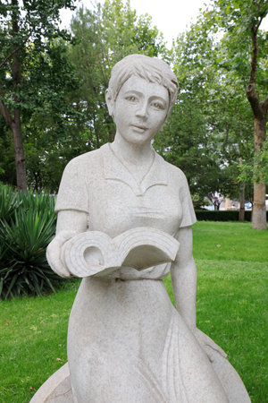 Girl Reading Sculpture in the Park, Shijiazhuang City, Hebei Province, Chinaの写真素材