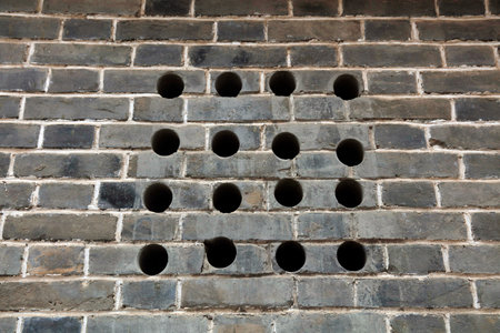 round hole on the grey wallの写真素材