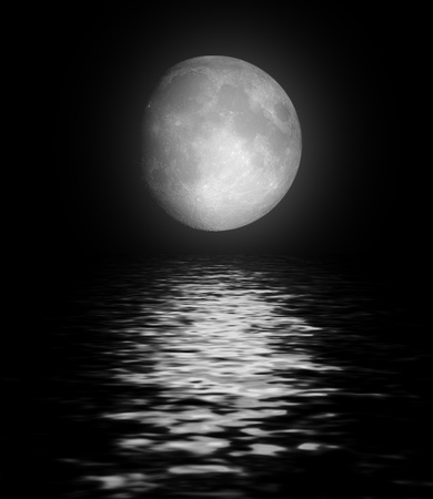 Full moon reflected in waterの写真素材