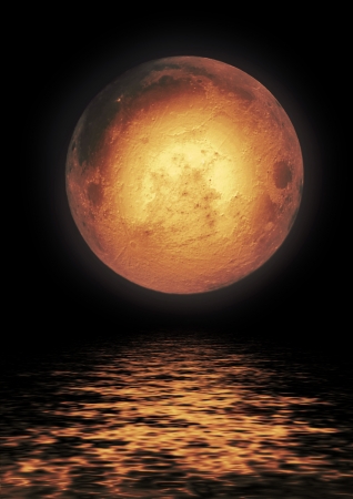 Full moon reflected in waterの写真素材