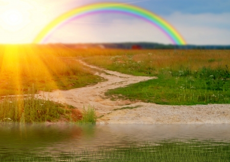 Rainbow the sun and a grassの写真素材