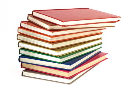 pile of multi-colored books on a white backgroundの写真素材