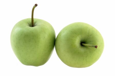 Green apples on white background, fruit healthy concept, side viewの写真素材