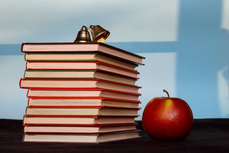 Pile of books with apple, education, reading, back to school concept, copy space text. Design concept.の写真素材