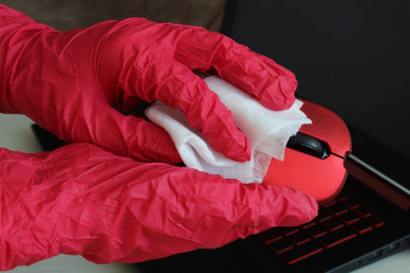 Disinfection of your workspace, the fight against the virus, coronavirus COVID-19. A female hand...