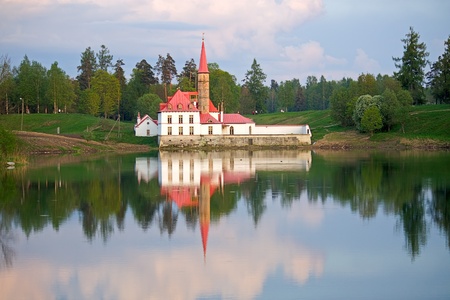 View of the Priory Palace and its reflection in the lake, Gatchina, Russiaの写真素材