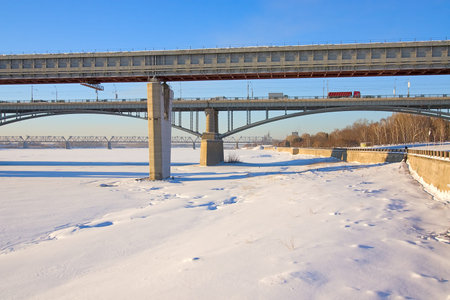 Two bridges across river winter against blue sky, Russiaの写真素材