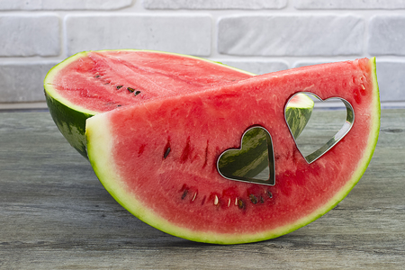 Watermelon on a gray wooden backgroundの写真素材