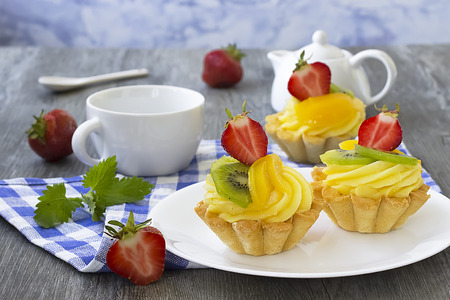 Fruit  tartlets dessert with cream. French bakery catering. Soft focus.の写真素材