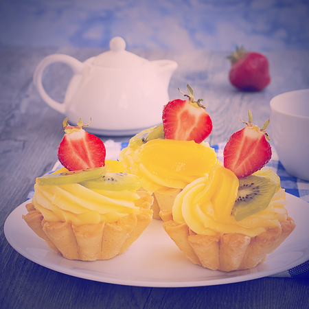 Fruit  tartlets dessert with cream. French bakery catering. Soft focus.の写真素材