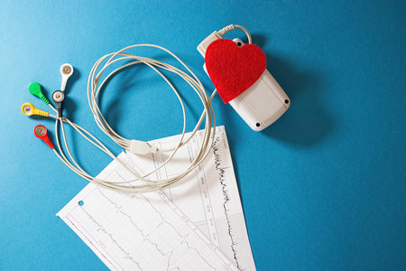 Holter monitoring device on blue  background. Soft focus.の写真素材