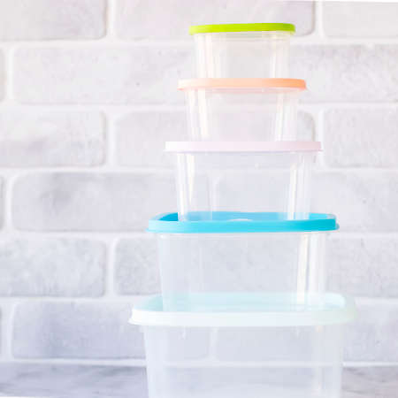 Plastic storage containers with colored lids. Soft focus.の写真素材