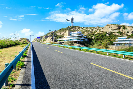 Empty and clean asphalt road and natural mountain landscape in spring, Asiaのeditorial素材