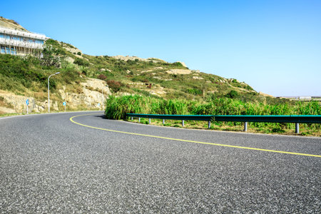 Empty and clean asphalt road and natural mountain landscape in spring, Asia