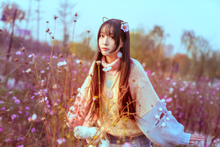 A maiden surrounded by flowersの写真素材