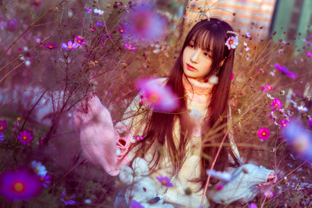 A maiden surrounded by flowersの写真素材