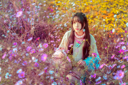 A maiden surrounded by flowersの写真素材