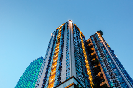 Look up at the lighted building in the eveningのeditorial素材