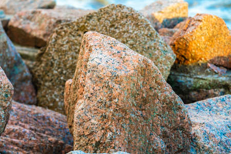 Rocks by the sea under the blue skyの写真素材