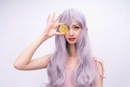 A girl with long hair in pinkの写真素材