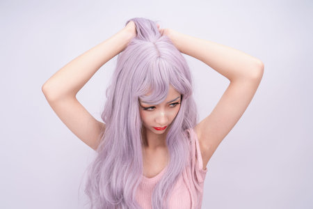 A girl with long hair in pinkの写真素材