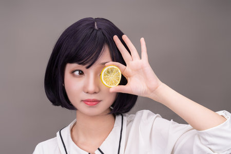 A young girl with short hair dressed in whiteの写真素材