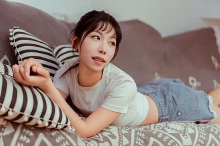 A young girl in short-sleeved shortsの写真素材