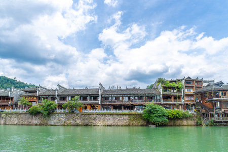 This photo was taken in Fuxi Mountain, Henan, China, showing the perfect blend of natural scenery and classical architecture.の写真素材