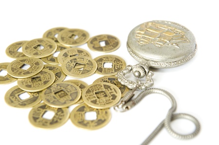 pocket watch and Chinese ancient currencyの写真素材