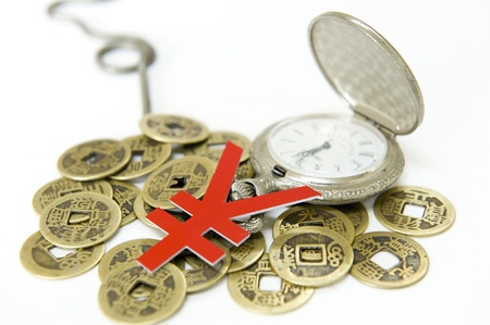 pocket watch and Chinese ancient currencyの写真素材