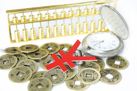 pocket watch and Chinese ancient currencyの写真素材