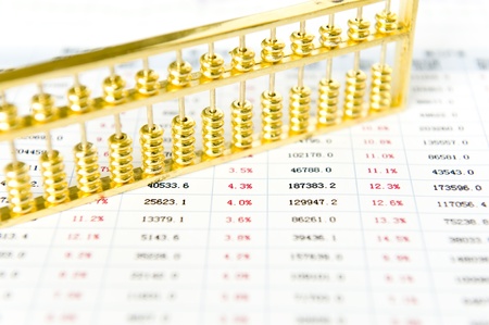 Gold abacus and statistical reportの写真素材