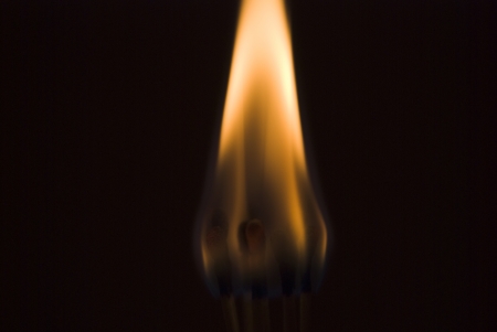 set of burning matches on black backgroundの写真素材