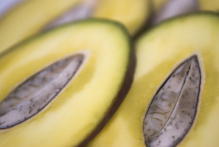 sliced tropical fruit on white background , mango
