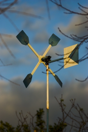windmill craft under cloudy sky , weather , metalの写真素材