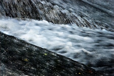 detail of a river water in a damの写真素材