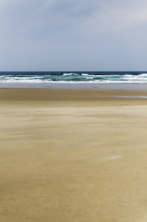 landscape lonely beach day with cloudy skyの写真素材