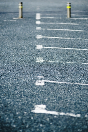 row of empty parking spaces outside, backgroundの写真素材