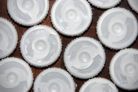 plastic caps of white on wooden backgroundの写真素材