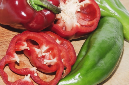 red and green peppers on wood , natural productの写真素材