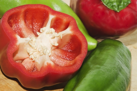 red and green peppers on wood , natural productの写真素材