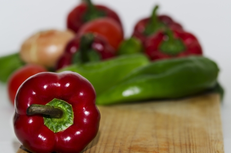 red and green peppers on wood , natural productの写真素材