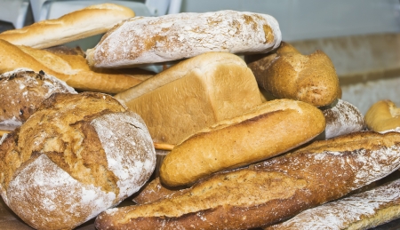 different types of freshly baked artisan breadの写真素材