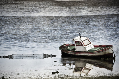 fishing boat on the shore of the beach