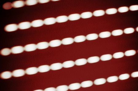 white lights on the wall, symmetrical formsの写真素材